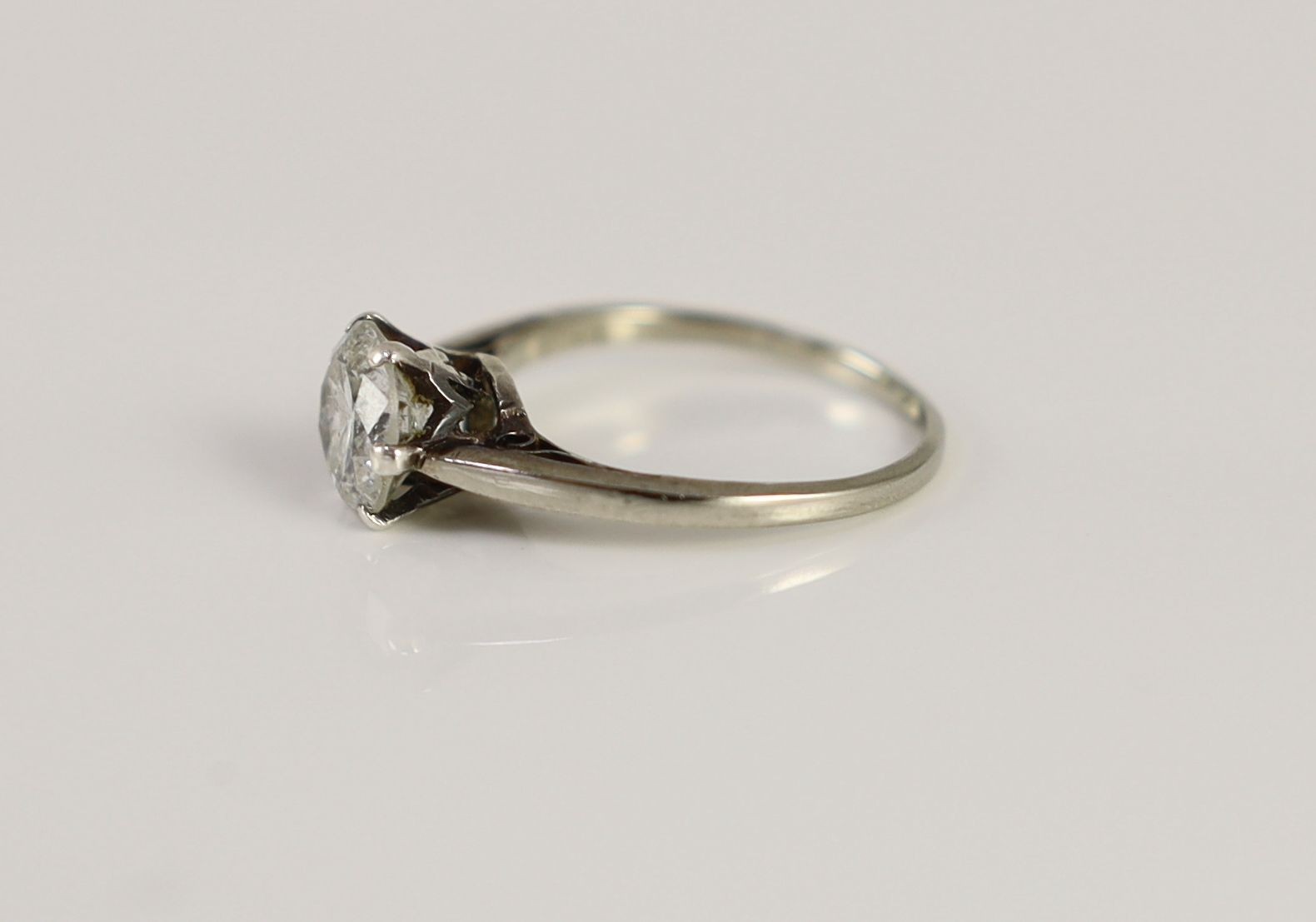 A 9ct white gold and solitaire diamond ring